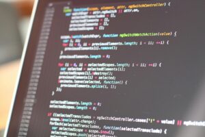 Software development cost - programming code on screen