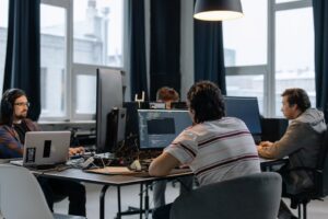 Dedicated development team working together on software projects - in-house vs outsourced comparison