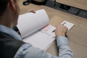 Software development SLA guide document being reviewed by business professional